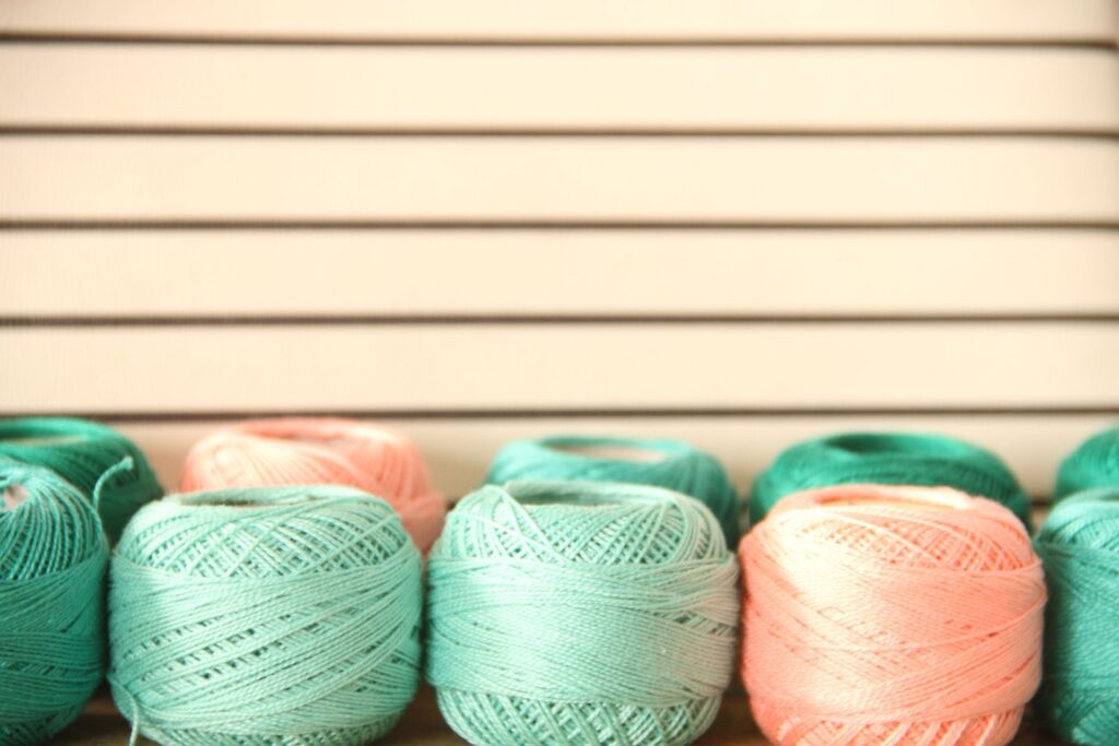 Balls of yarn arranged in soft light