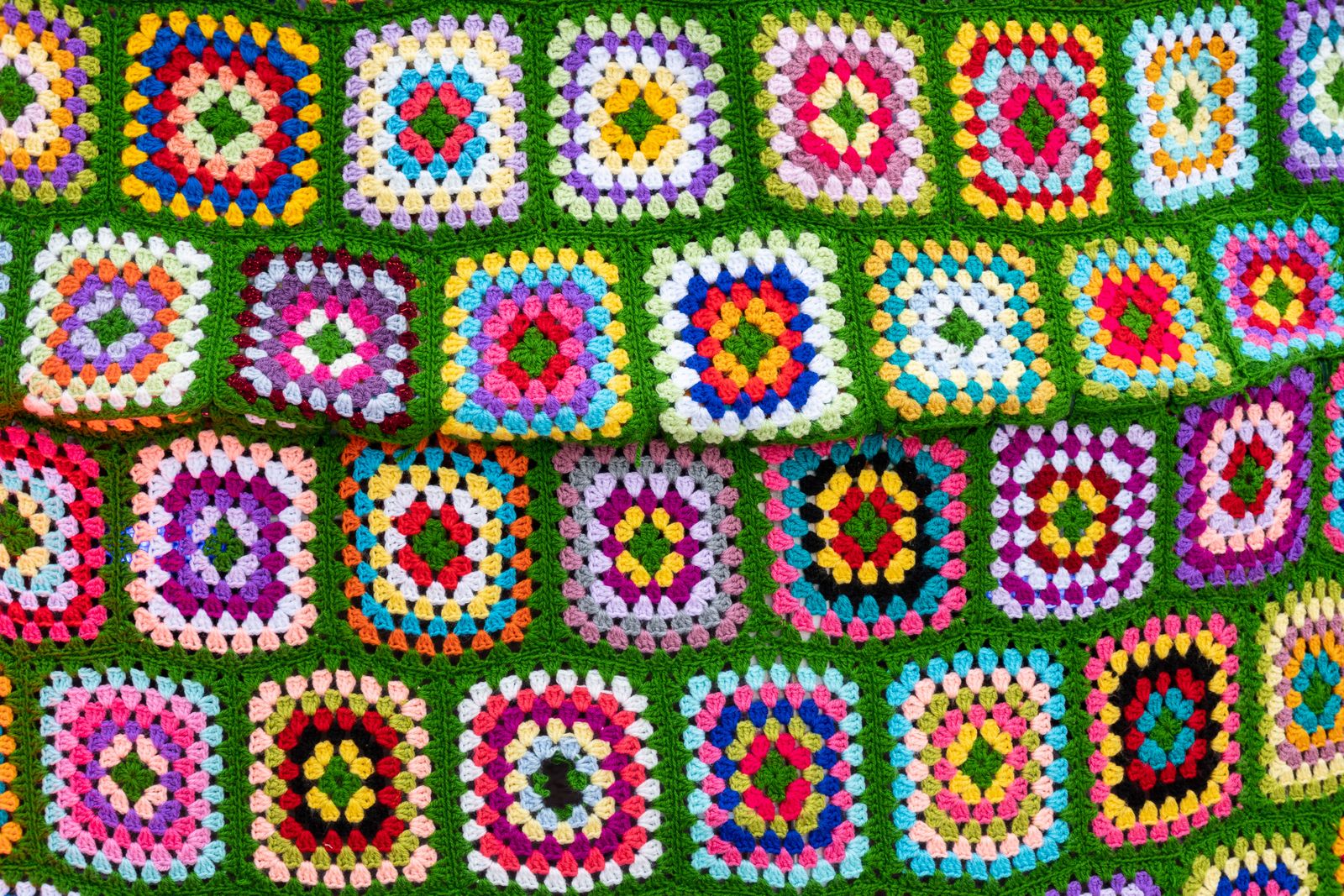 Vibrant crochet afghan with geometric patterns