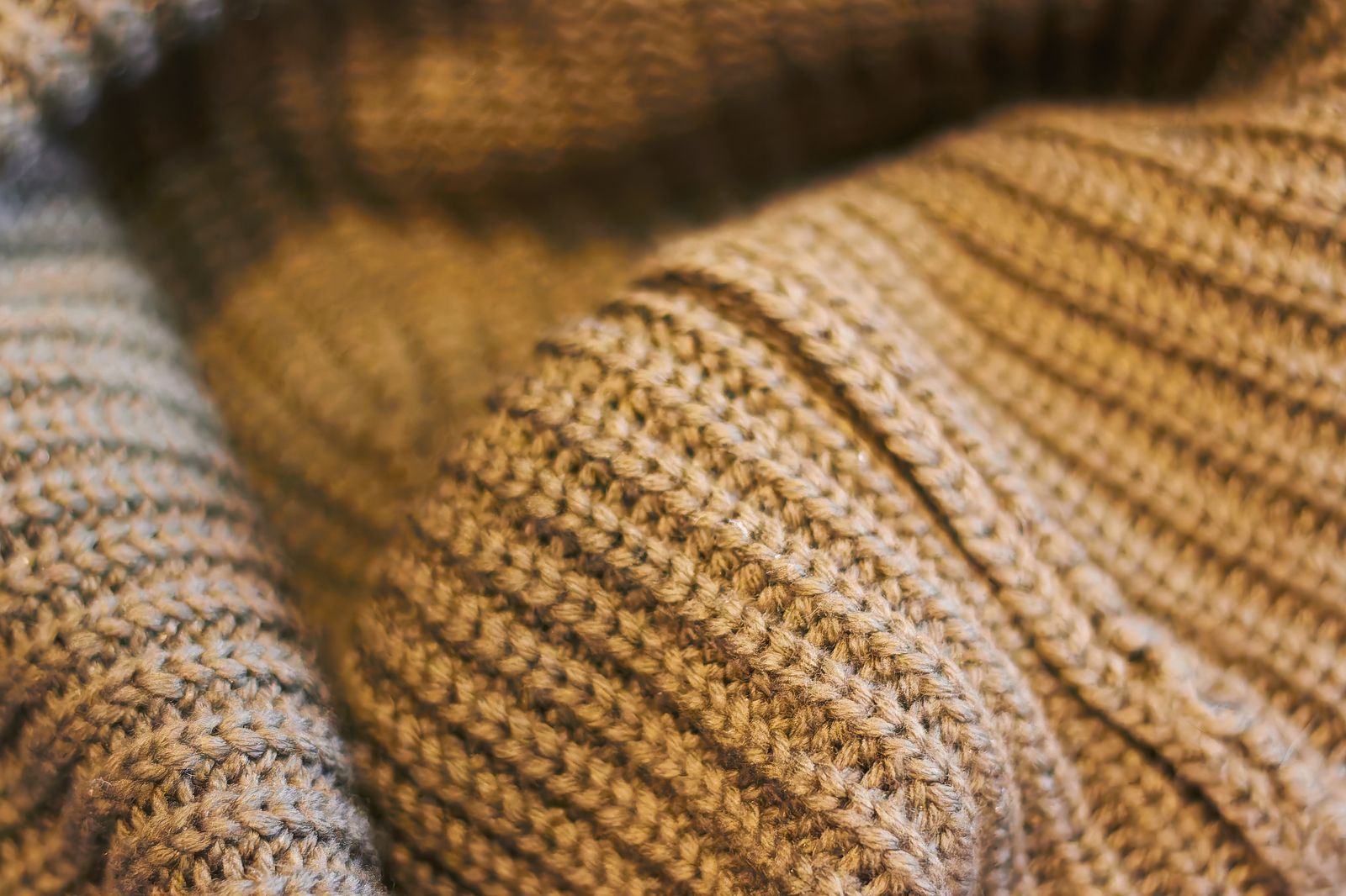 Detailed view of a warm knitted woolen fabric, highlighting texture